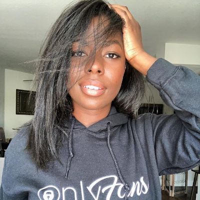 Photo of Camille Winbush wearing a only fan's hoodie.